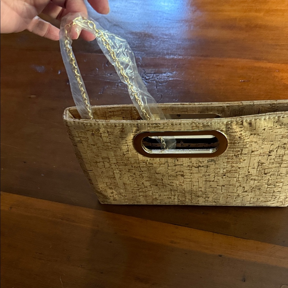 Chic cork clutch with cutout.